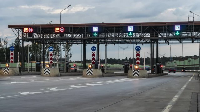 Departure of cars through toll on the freeway, time lapse