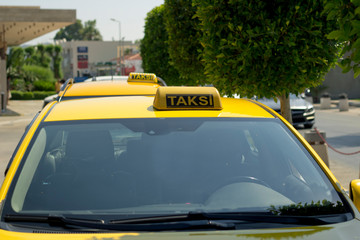 Taxi in Turkey. Yellow taxi color on the roof of the car sign.