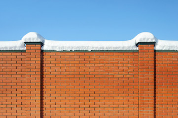 Red brick fence in winter