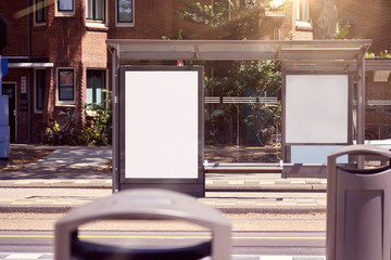 Mockup of a blank empty white advertising urban billboard, placeholder template at city tram stop, space for design layout.
