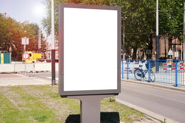 Mockup of a blank empty white advertising urban billboard, placeholder template city street, space for design layout.