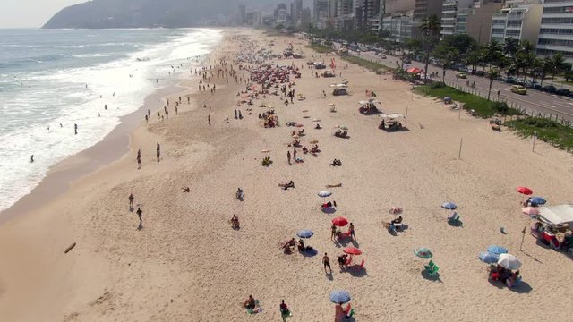 Aerial tilt up shot of Ipanema Beach during summer in Rio de Janeiro, Brazil.