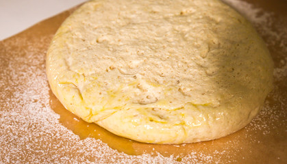 Yeast dough on the table. Baking concept. Cooking ideas. Homemade food. Knead flour and water.