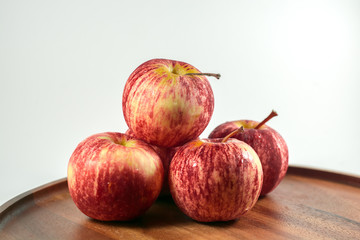 red apples on wooden table