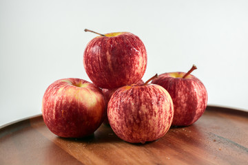 red apples on wooden table