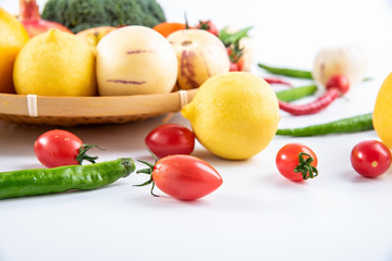 Fresh seasonal vegetables fruits and small tomatoes close-up