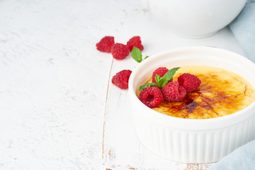 Crema catalana, Spanish dessert with berries in white ramekin, side view, fodmap recipe