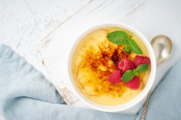 Crema catalana, Spanish dessert with berries in white ramekin, top view, fodmap recipe