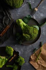 Organic broccoli on a plate on a dark background