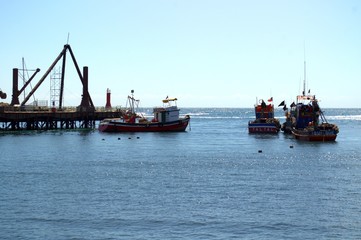 Fishing trawlers sailing off port in Antofagasta, Chile