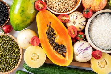 Full screen of fresh seasonal fruits and vegetables and grains of legumes