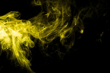 Yellow smoke on black background