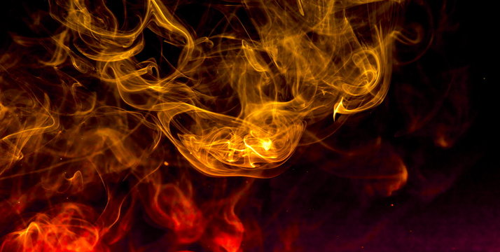 Colored smoke on black background