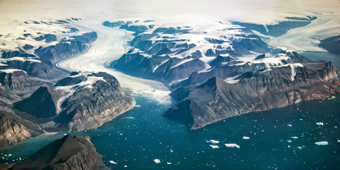 Western coast of Greenland, aerial view of glacier,  mountains and ocean - obrazy, fototapety, plakaty