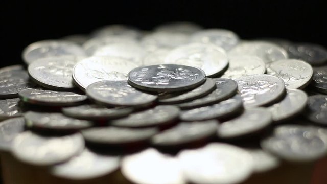 Close Up Of Rotating Lithuanian Aluminum Cent Coins On Black Background.