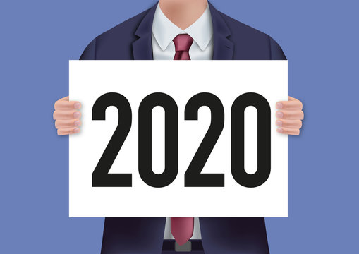 Pour présenter le bilan de l’entreprise, un homme en costume cravate porte une pancarte blanche sur lequel est écrit 2020
