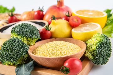 Full screen of fresh seasonal fruits and vegetables and grains of legumes