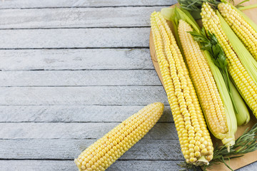 Corn on wooden table with copy space