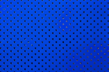 Navy blue background from metal foil paper with a silver stars pattern.