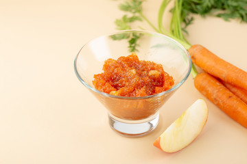 Apple and carrots chutney in glass bowl