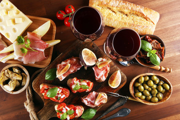 Italian antipasti wine snacks set. Cheese variety, Mediterranean olives, Prosciutto di Parma,...