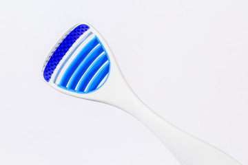 Toothbrush and tongue scraper