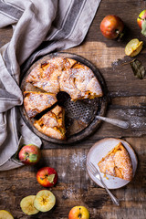 Apple pie on a wooden background. Fragrant autumn baking.