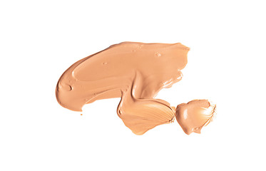 Naklejka premium Gently beige smear of makeup creamy foundation isolated on white background.