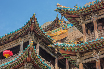 Fototapeta premium Roofs of protective wooden structures in front of the Yungang Grottoes near Datong