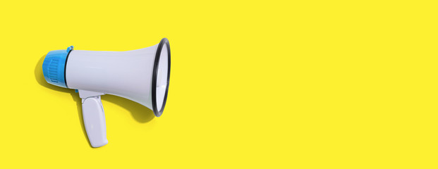 White megaphone with hard shadow overhead view
