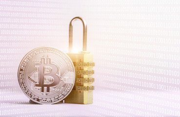 Bitcoin(BTC) coin with padlock lying on white background..Bitcoin security. digital cyber safety or security encryption, Blockchain technology to encode online information or data protection.