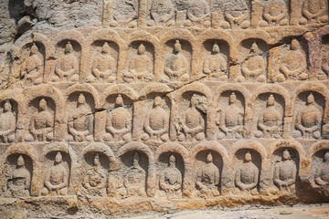 Close up of figurines outside a cave in the Yungang Grottoes near Datong