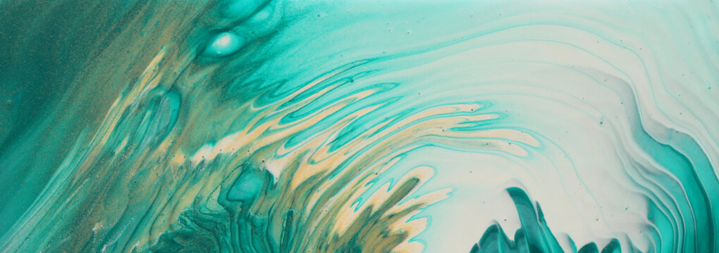 art photography of abstract marbleized effect background. turquoise, emerald green, blue and gold creative colors. Beautiful paint. banner