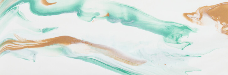 photography of abstract marbleized effect background. gold and white creative colors. Beautiful paint. banner
