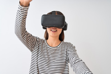 Young beautiful chinese woman playing virtual reality game using goggles