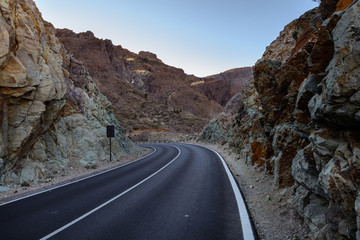 Beautiful Country roads and nature. Driving between rocks. The road between the rocks leading to the mountains.