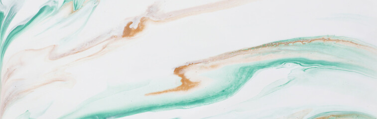 photography of abstract marbleized effect background. gold and white creative colors. Beautiful paint. banner