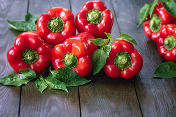 ripe red pepper. pepper on a wooden background close-up. harvested paprika.