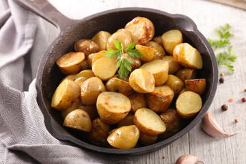 grilled potatoes and herb in a casserole