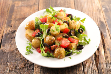 mixed vegetable salad with potato, tomate, olive and salad