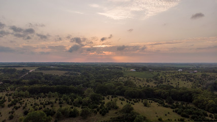 Storm clouds over rural Nebraska countryside and sunrise