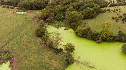 Sunrise over rural Nebraska wetland and stock pond