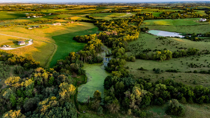 Sunrise over rural Nebraska wetland and stock pond