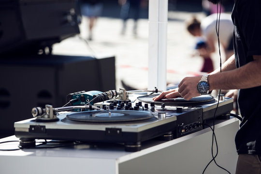 Dj playing and mixing music on outdoor at party festival