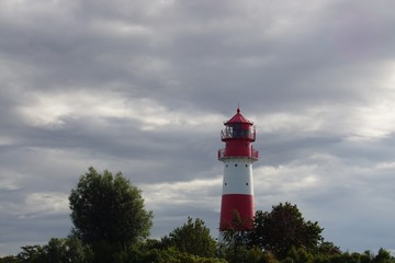 lighthouse on coast of sea