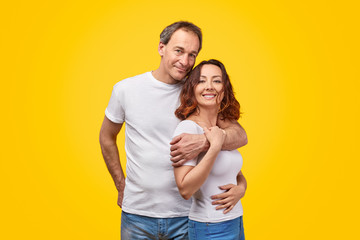 Happy mature couple looking at camera