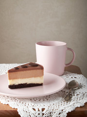 chocolate cake white and dark chocolate on a pink plate