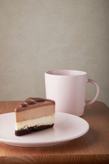 chocolate cake white and dark chocolate on a pink plate