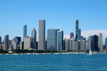 Obraz na płótnie Canvas Chicago downtown skyline with Michigan lake.Scenic summer cityscape with lakefront skyscrapers of Chicago with drifting yachts on the Michigan lake harbor. American urban city architecture background.