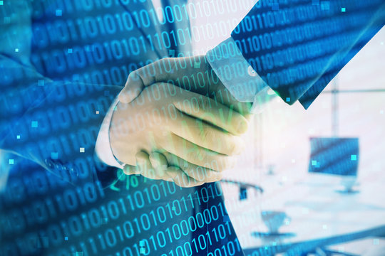Double exposure of hacking theme hologram on office background with two men handshake. Concept of data security